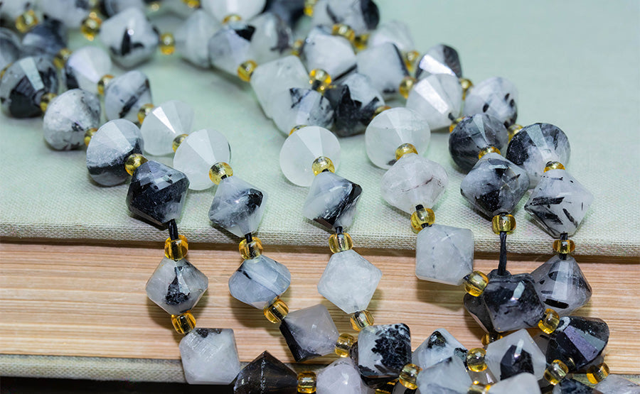 The Sparkle of Symmetry: Bicone-Shaped Gemstone Beads