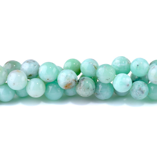 This is a Dakota Stones 14mm Australian Chrysoprase Gemstone strand with AA grade round beads in 15-16 inch strand.