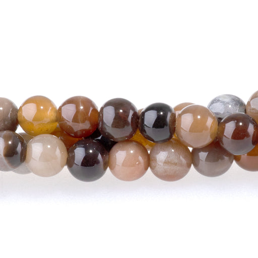 This is a Dakota Stones 4mm African Petrified Wood Agate Gemstone strand with round beads in 15-16 inch strand.
