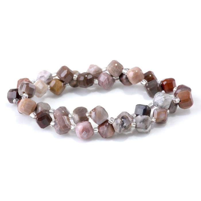 This is a Dakota Stones 6x8mm African Petrified Wood Agate Corner Gemstone strand with table-cut cube beads in 15-16 inch strand.
