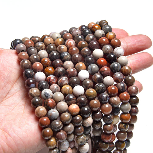 This is a Dakota Stones 8mm African Petrified Wood Agate Large Gemstone strand with round beads in 8 inch strand.