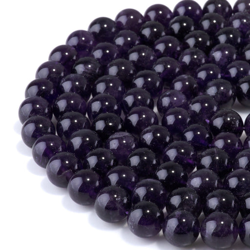 This is a Dakota Stones 10mm Amethyst Gemstone strand with A grade round beads in 15-16 inch strand.