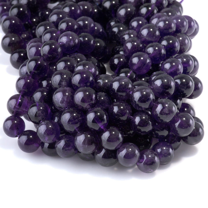 This is a Dakota Stones 10mm Amethyst Gemstone strand with A grade round beads in 15-16 inch strand.