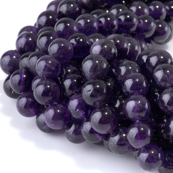 This is a Dakota Stones 10mm Amethyst Gemstone strand with A grade round beads in 15-16 inch strand.