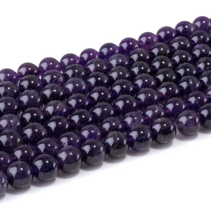 This is a Dakota Stones 10mm Amethyst Gemstone strand with A grade round beads in 15-16 inch strand.