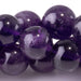 This is a Dakota Stones 10mm Amethyst Gemstone strand with A grade round beads in 15-16 inch strand.