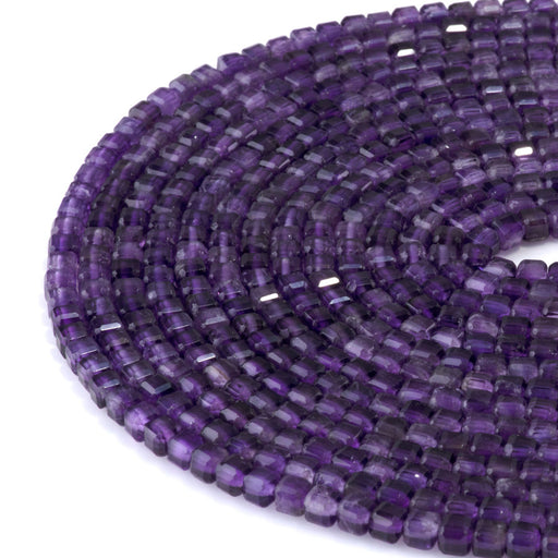 This is a Dakota Stones 4mm Amethyst Gemstone strand with natural A grade table-cut cube beads in 15-16 inch strand.