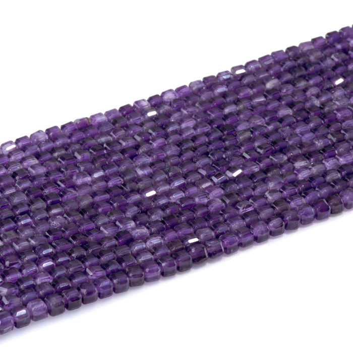 This is a Dakota Stones 4mm Amethyst Gemstone strand with natural A grade table-cut cube beads in 15-16 inch strand.
