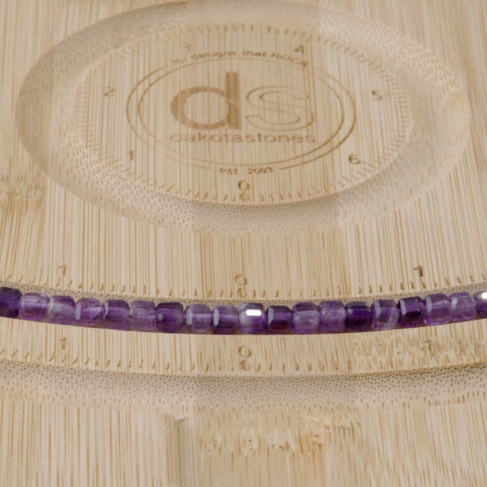 This is a Dakota Stones 4mm Amethyst Gemstone strand with natural A grade table-cut cube beads in 15-16 inch strand.
