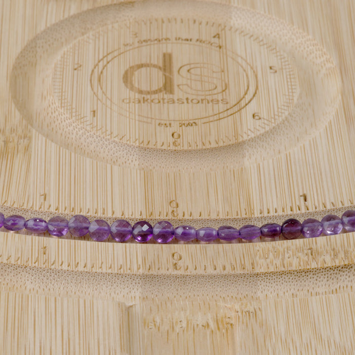 This is a Dakota Stones 4mm Amethyst Gemstone strand with A grade faceted coin beads in 15-16 inch strand.
