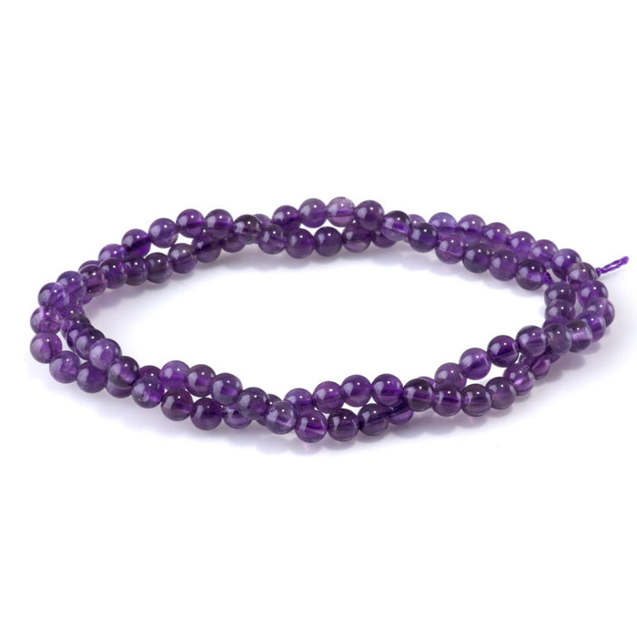 This is a Dakota Stones 4mm Amethyst Gemstone strand with A grade round beads in 15-16 inch strand.