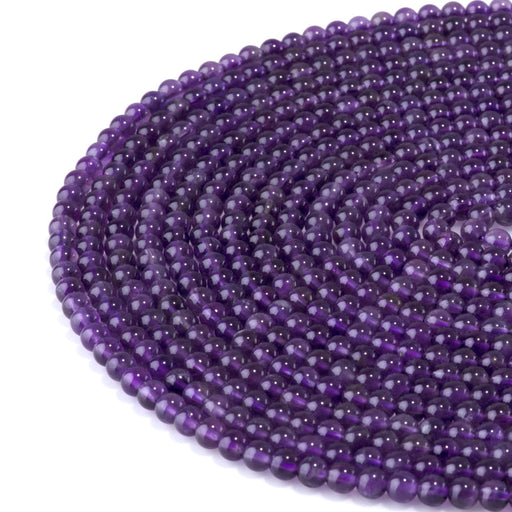 This is a Dakota Stones 4mm Amethyst Gemstone strand with A grade round beads in 15-16 inch strand.