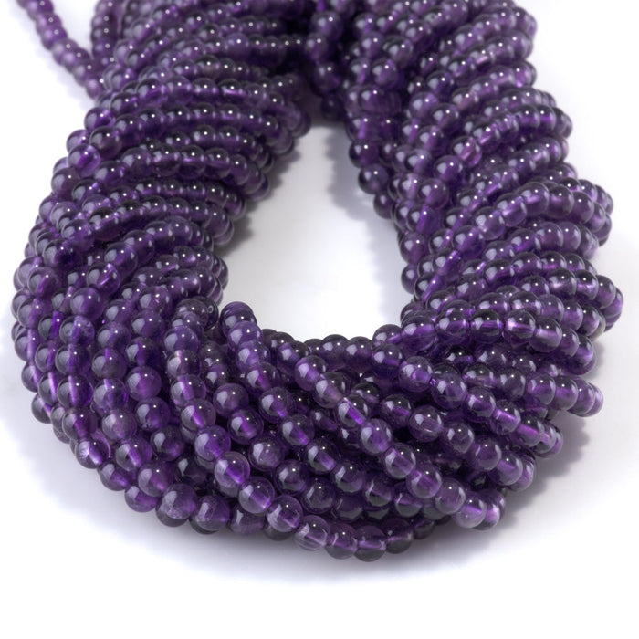 This is a Dakota Stones 4mm Amethyst Gemstone strand with A grade round beads in 15-16 inch strand.