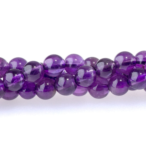 This is a Dakota Stones 4mm Amethyst Gemstone strand with A grade round beads in 15-16 inch strand.