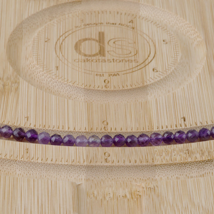 This is a Dakota Stones 4mm Amethyst Gemstone strand with A grade faceted round beads in 15-16 inch strand.