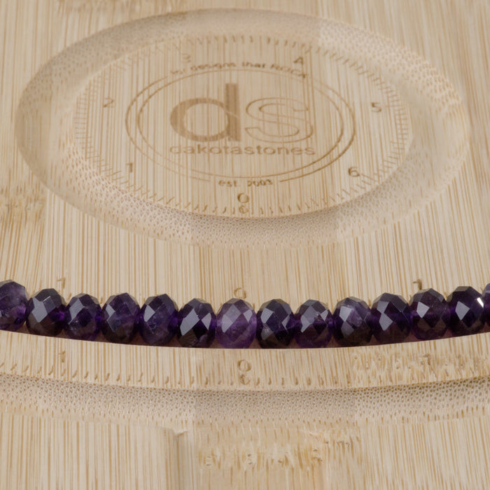 This is a Dakota Stones 5x8mm Amethyst Gemstone strand with A grade faceted rondelle beads in 15-16 inch strand.