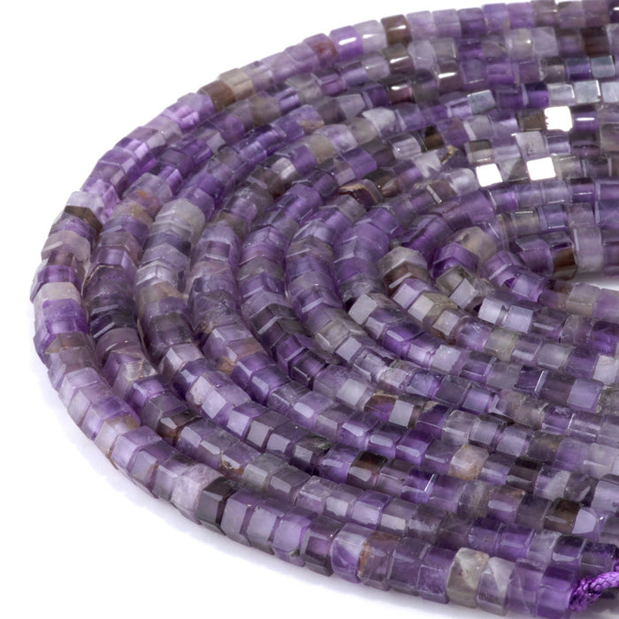 This is a Dakota Stones 6mm Amethyst Large Hole Gemstone strand with faceted hexagon beads in 8 inch strand.