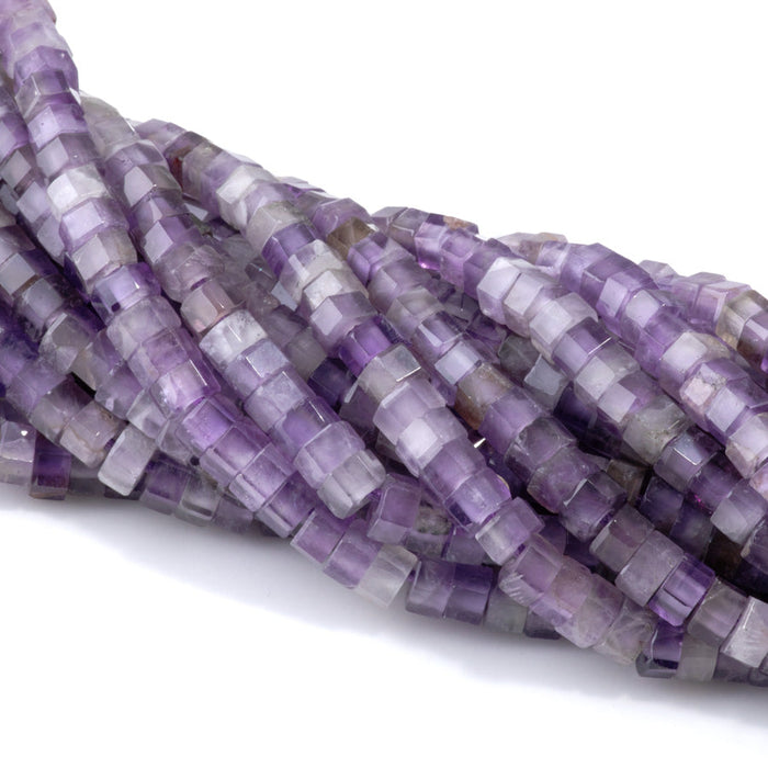 This is a Dakota Stones 6mm Amethyst Large Hole Gemstone strand with faceted hexagon beads in 8 inch strand.