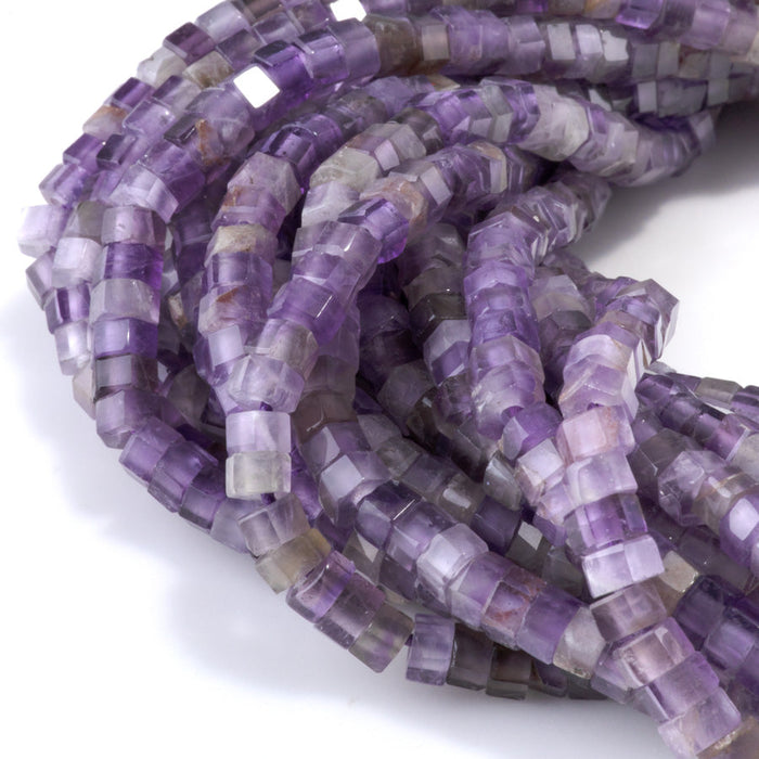 This is a Dakota Stones 6mm Amethyst Large Hole Gemstone strand with faceted hexagon beads in 8 inch strand.