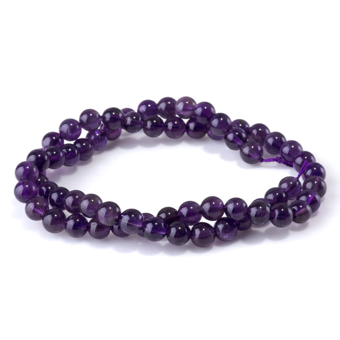 This is a Dakota Stones 6mm Amethyst Gemstone strand with A grade round beads in 15-16 inch strand.