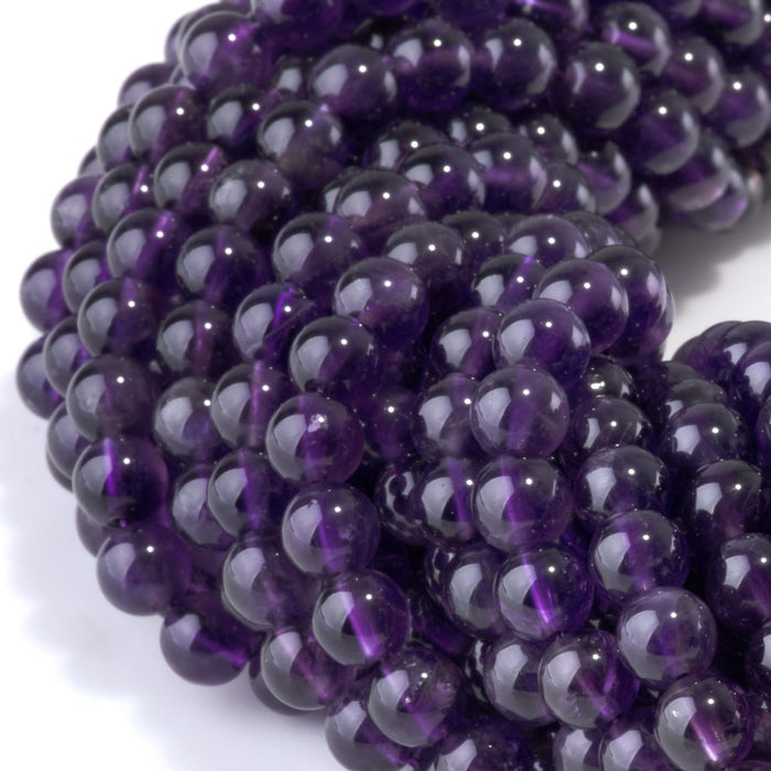 This is a Dakota Stones 6mm Amethyst Gemstone strand with A grade round beads in 15-16 inch strand.