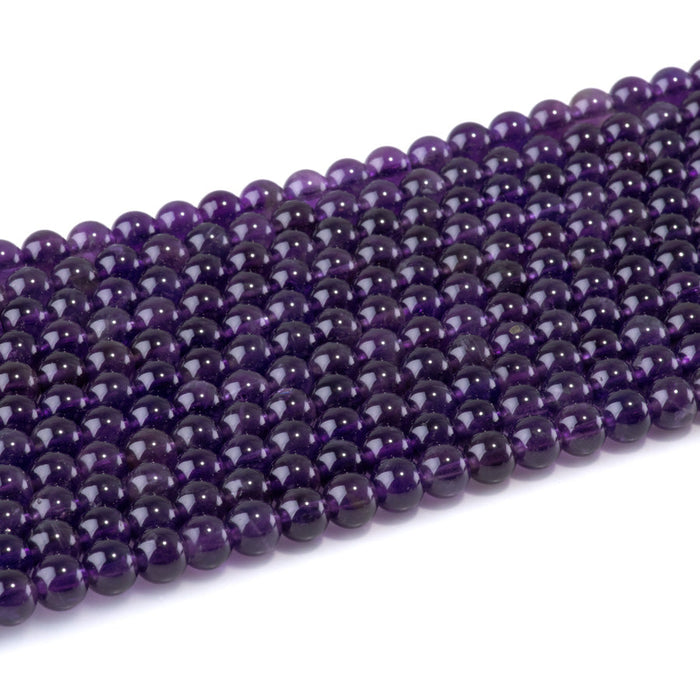 This is a Dakota Stones 6mm Amethyst Gemstone strand with A grade round beads in 15-16 inch strand.