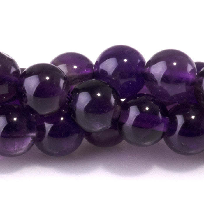 This is a Dakota Stones 6mm Amethyst Gemstone strand with A grade round beads in 15-16 inch strand.