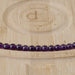 This is a Dakota Stones 6mm Amethyst Gemstone strand with A grade round beads in 15-16 inch strand.