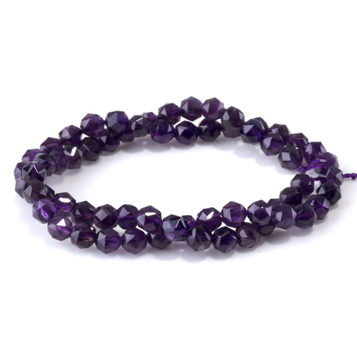 This is a Dakota Stones 6mm Amethyst Gemstone strand with A grade double heart faceted round beads in 15-16 inch strand.
