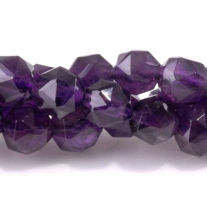 This is a Dakota Stones 6mm Amethyst Gemstone strand with A grade double heart faceted round beads in 15-16 inch strand.
