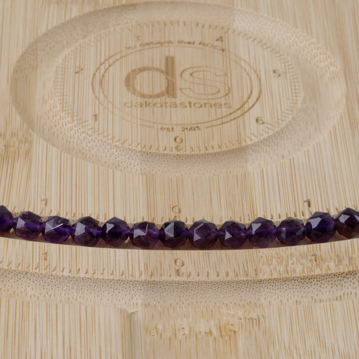 This is a Dakota Stones 6mm Amethyst Gemstone strand with A grade double heart faceted round beads in 15-16 inch strand.