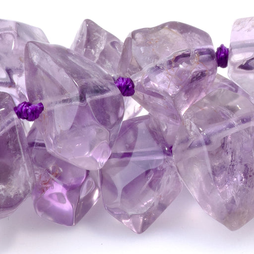 This is a Dakota Stones 8x12-10x14mm Amethyst Drill Gemstone strand with A grade faceted nugget beads in 15-16 inch strand.