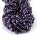 This is a Dakota Stones 8mm Amethyst Gemstone strand with A grade star cut faceted coin beads in 15-16 inch strand.