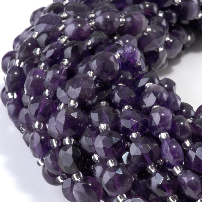 This is a Dakota Stones 8mm Amethyst Gemstone strand with A grade star cut faceted coin beads in 15-16 inch strand.
