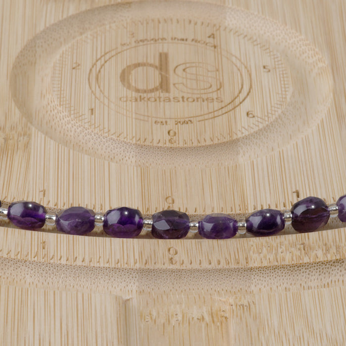 This is a Dakota Stones 8mm Amethyst Gemstone strand with A grade star cut faceted coin beads in 15-16 inch strand.