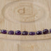 This is a Dakota Stones 8mm Amethyst Gemstone strand with A grade star cut faceted coin beads in 15-16 inch strand.