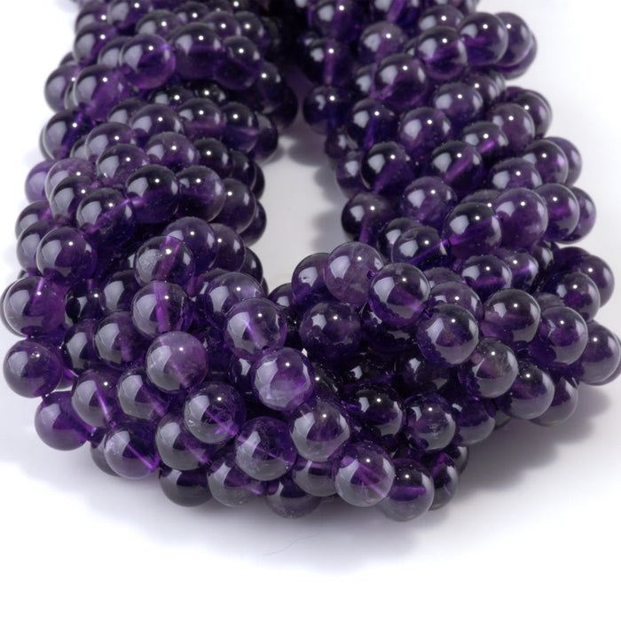 This is a Dakota Stones 8mm Amethyst Gemstone strand with A grade round beads in 15-16 inch strand.