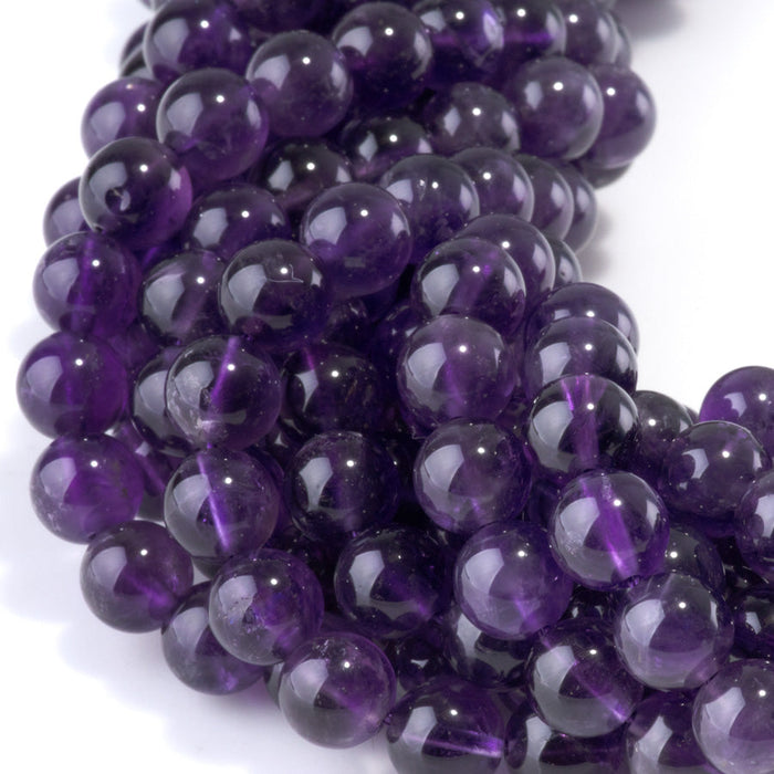 This is a Dakota Stones 8mm Amethyst Gemstone strand with A grade round beads in 15-16 inch strand.