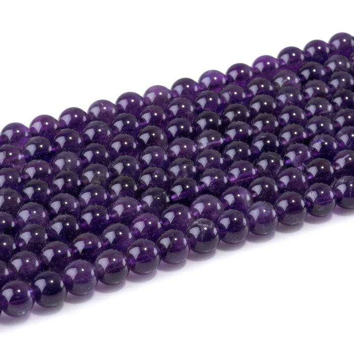 This is a Dakota Stones 8mm Amethyst Gemstone strand with A grade round beads in 15-16 inch strand.