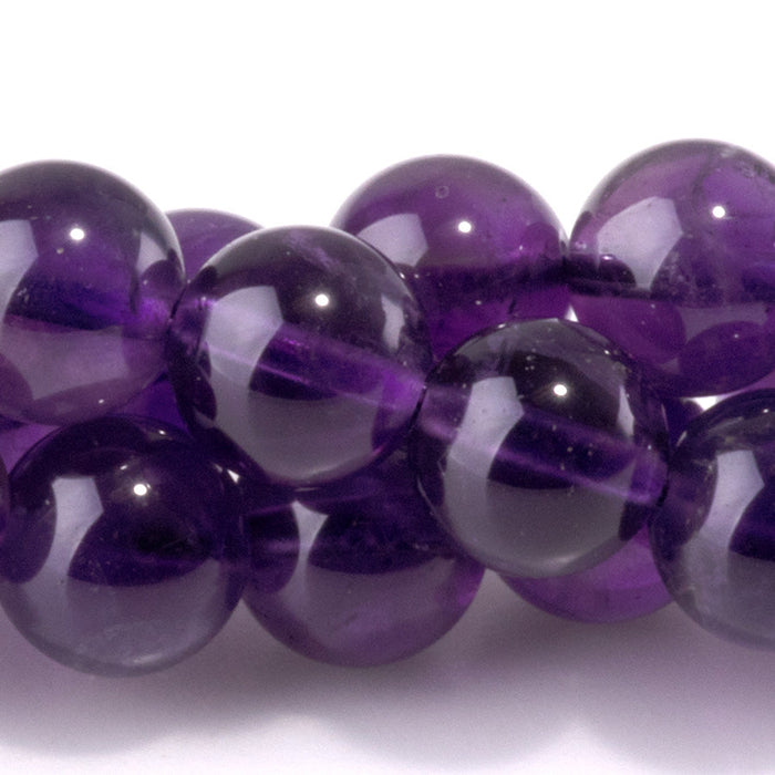 This is a Dakota Stones 8mm Amethyst Gemstone strand with A grade round beads in 15-16 inch strand.