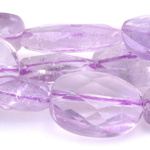 This is a Dakota Stones 9x11-13x18mm Light Amethyst Gemstone strand with A grade faceted free-form oval beads in 15-16 inch strand.