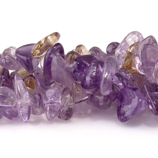 This is a Dakota Stones 3x7-6x12mm Ametrine Gemstone strand with chip beads in 15-16 inch strand.