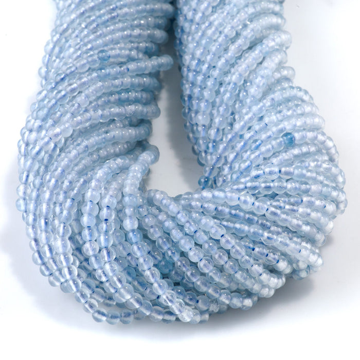 This is a Dakota Stones 3mm Aquamarine Gemstone strand with A grade round beads in 15-16 inch strand.