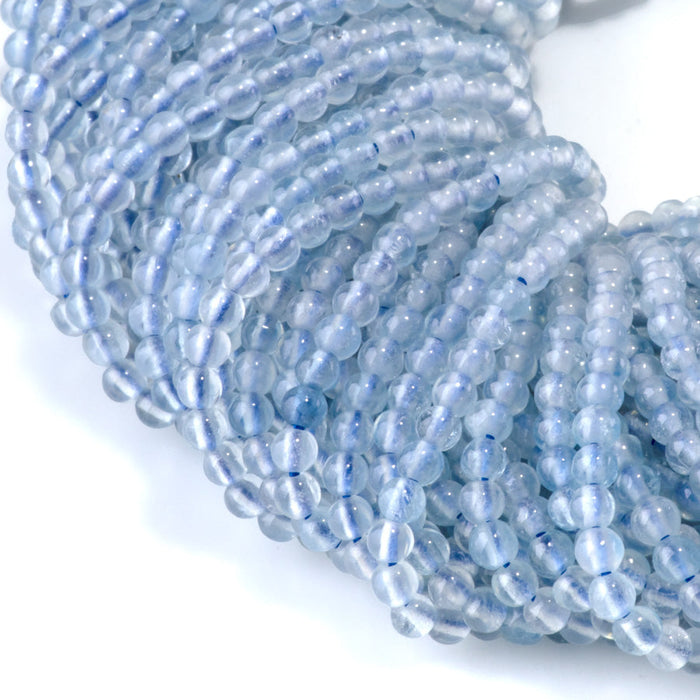 This is a Dakota Stones 3mm Aquamarine Gemstone strand with A grade round beads in 15-16 inch strand.