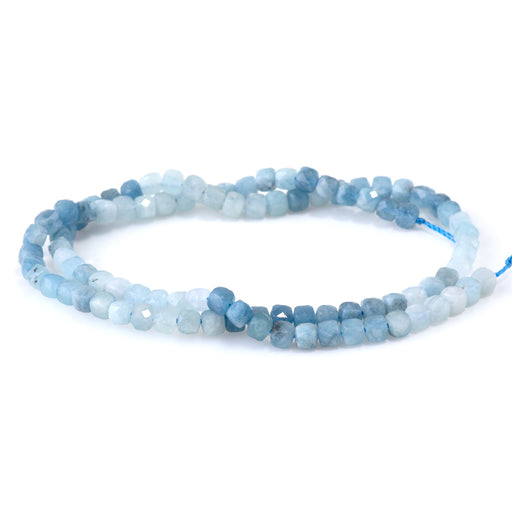 This is a Dakota Stones 4mm Aquamarine Banded Gemstone strand with faceted cube beads in 15-16 inch strand.