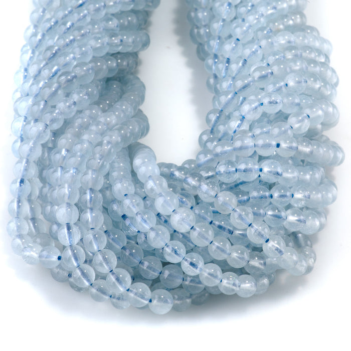 This is a Dakota Stones 4mm Aquamarine Gemstone strand with AAA grade round beads in 15-16 inch strand.