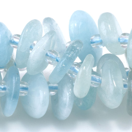 This is a Dakota Stones 5x8mm Aquamarine Gemstone strand with chip beads in 15-16 inch strand.