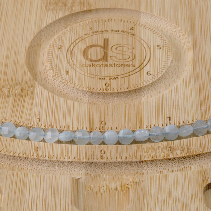 This is a Dakota Stones 6mm Aquamarine Gemstone strand with A grade faceted coin beads in 15-16 inch strand.