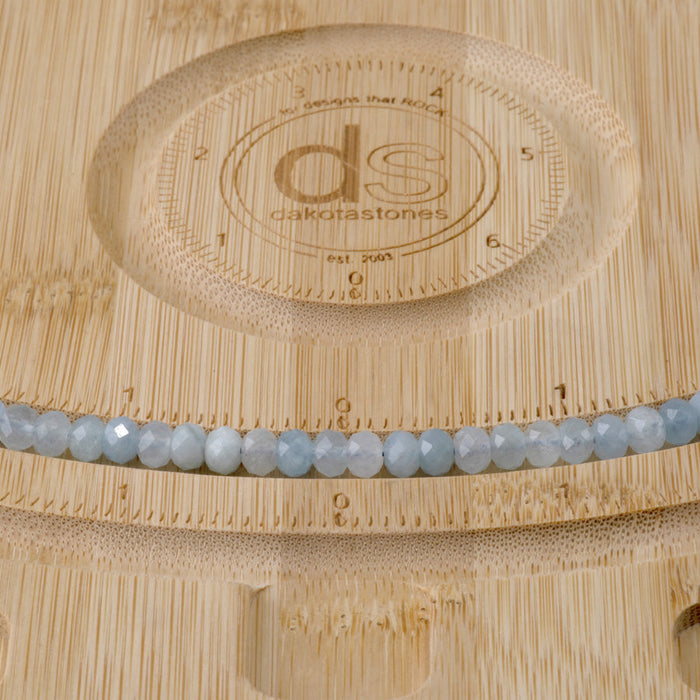 This is a Dakota Stones 4x6mm Aquamarine Gemstone strand with faceted rondelle beads in 15-16 inch strand.