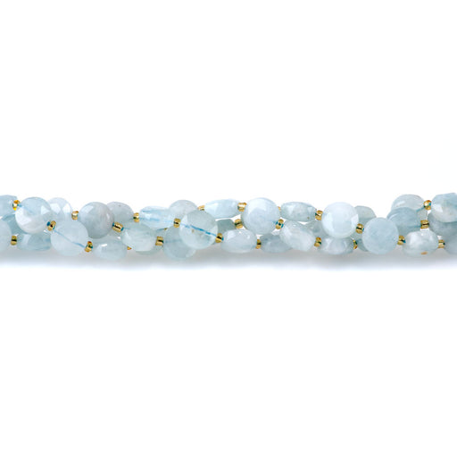 This is a Dakota Stones 8mm Aquamarine Cut Gemstone strand with A grade coin star beads in 15-16 inch strand.